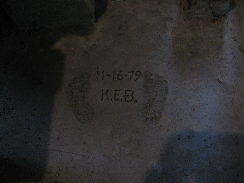 RadHardened's tweet photo. my infant footprints in concrete at my late grandmother's house (taken without flash) https://t.co/JMZs9BcKNj