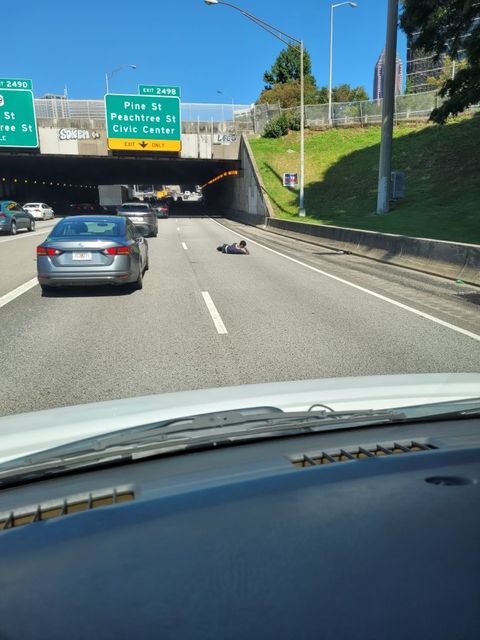GAFollowers's tweet photo. Atlanta is different..this man is casually laying in the middle of 75 like he's about to binge-watch a season on Netflix.😂 https://t.co/LN6O1AUpEF