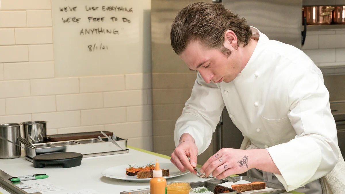 Taqueria chefs using tweezers to add stray lettuce to bean and cheese taco