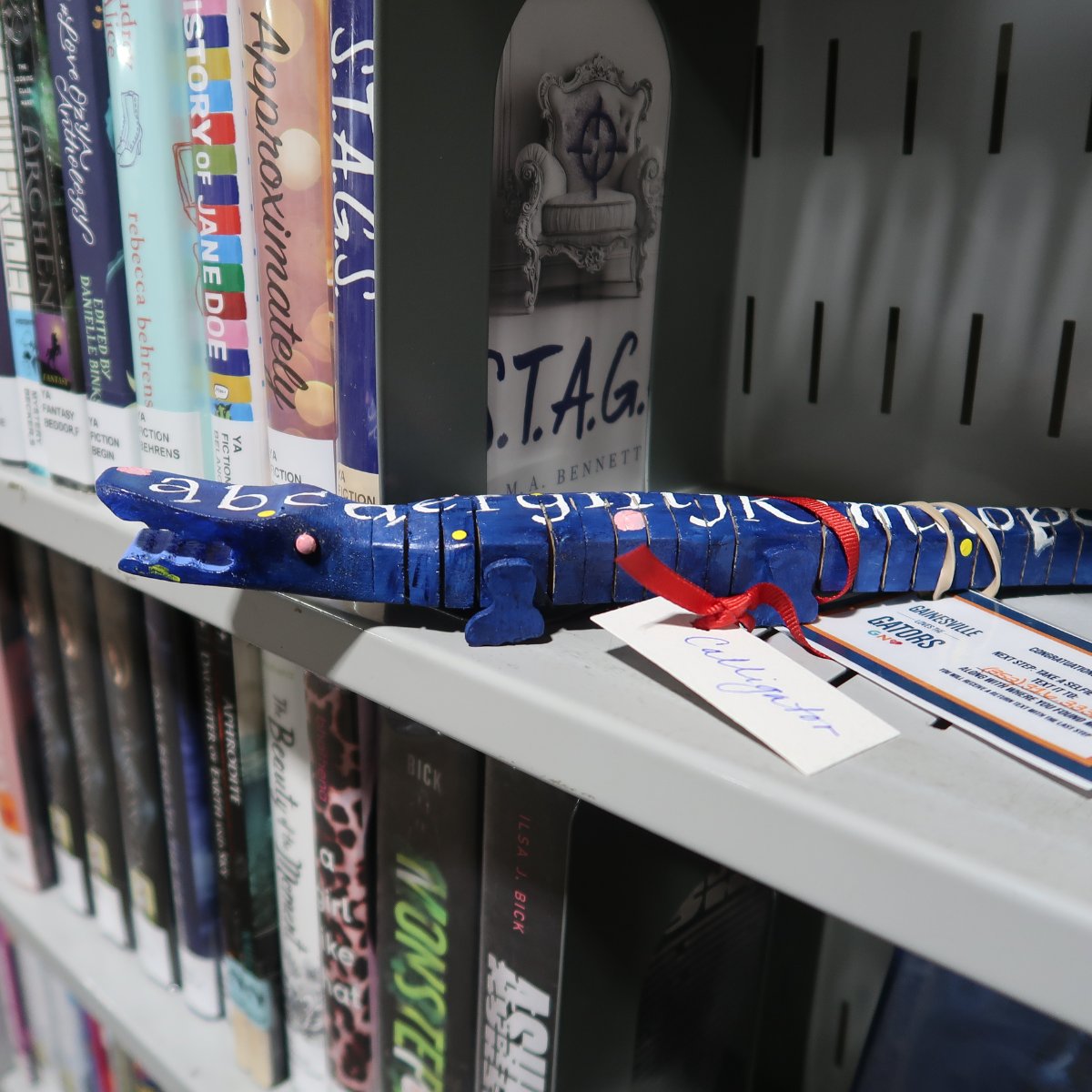 alachualibrary's tweet photo. ππ Calligator enjoyed their trip to Headquarters Library in downtown Gainesville. Congratulations to Stacey Berceli who found this gator!
#gnvlovesgators @GNVChamber
#dukeenergy #gainesvillesportscommission #artisansguildgallery https://t.co/it0lE28Jhx