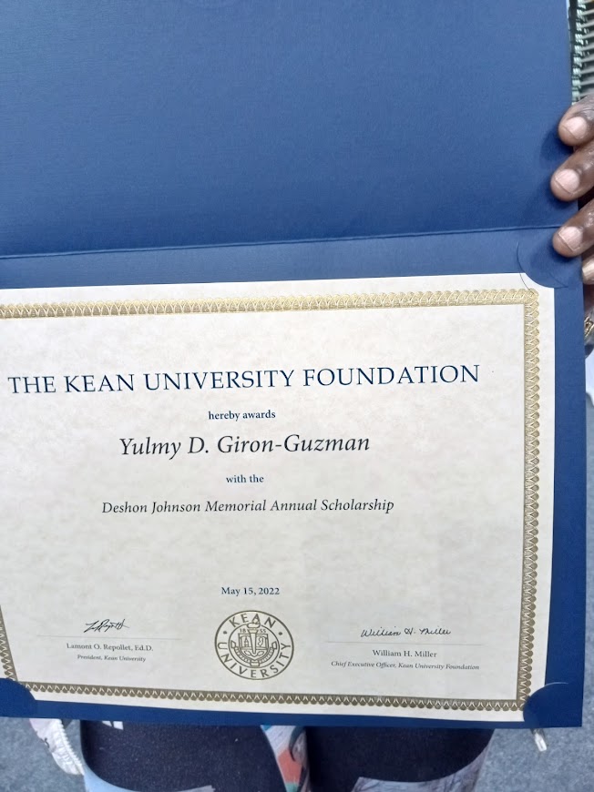 DJCSFoundation's tweet photo. #DeshonJohnson's mother is holding her son's #Memorial #KeanUniversity recipient certificate for one one of the #Business major #students. #Deshon was purposely killed by #NJTransit &amp; #CoachUSA bus driver Wilson Romaine. The driver never went to jail. #NewJersey #tmz #HBCU #news https://t.co/DqV15YP5PO
