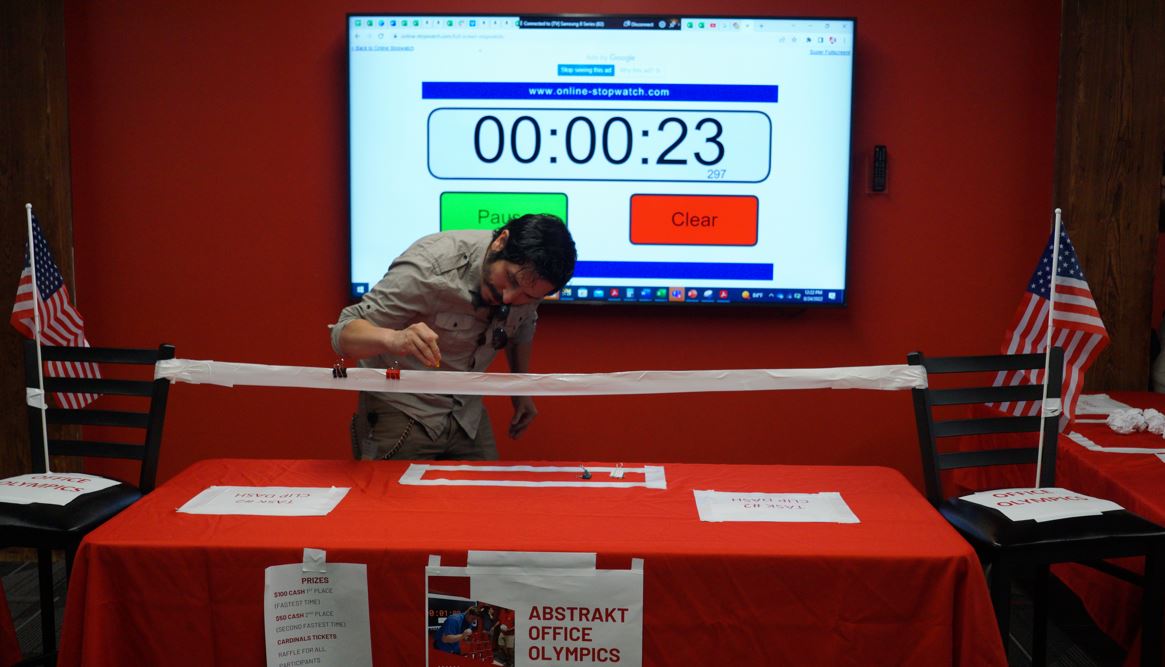 Last week, our team had office olympics challenge! Players were timed on a word search, binder clip race &amp; scratch paper basketball. We had over 75 players come through and play but the fastest time was Cassi at a quick 14 seconds. Check out some of our favorite office olym-PICS!