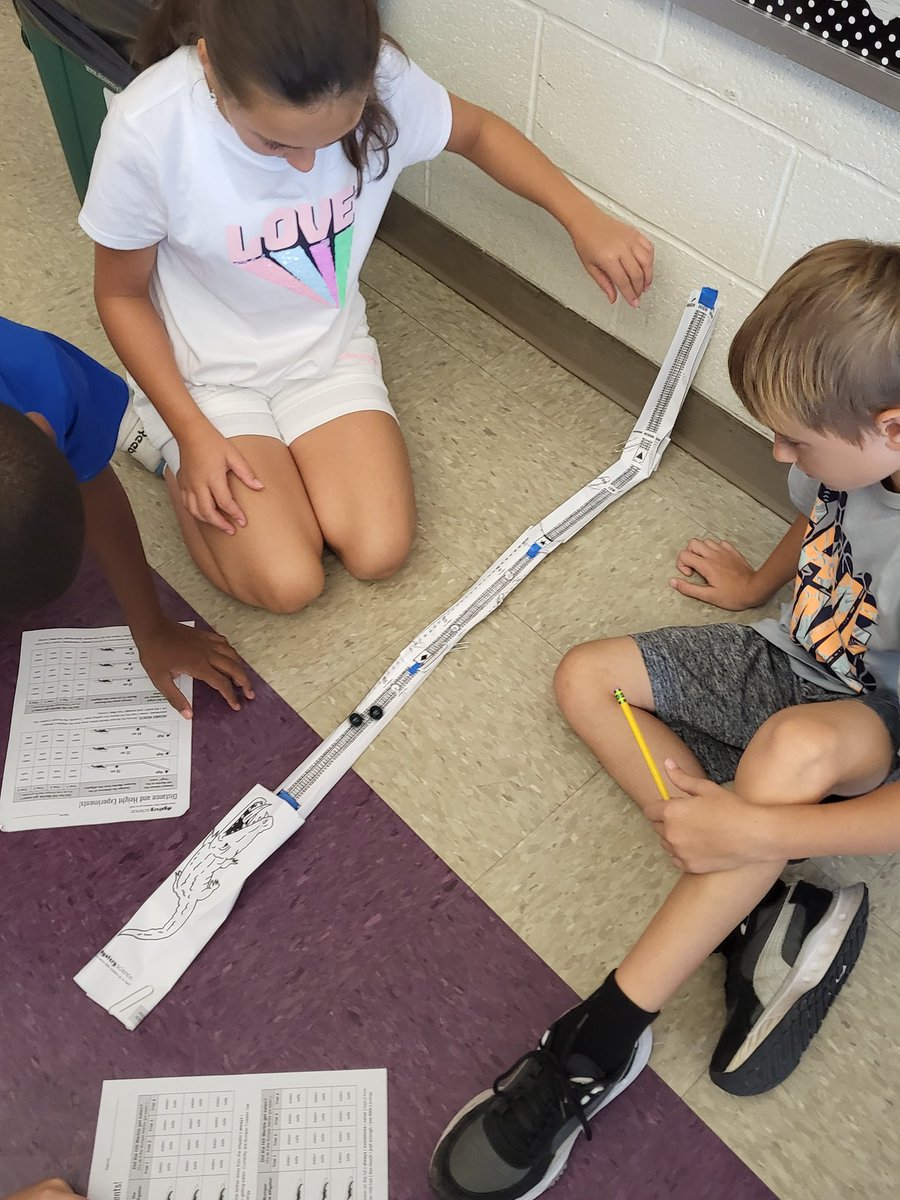 Students learning how energy is transferred during a collision through a bumper coaster lab <a href="/MysterySci/">Mystery Science</a>