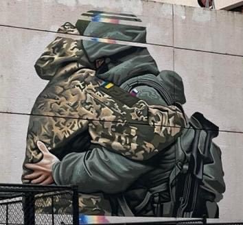 Культура: В Австралии художник нарисовал граффити с обнимающимися солдатами из РФ и Украины. Рисунок пришлось убрать — его сочли оскорбительным