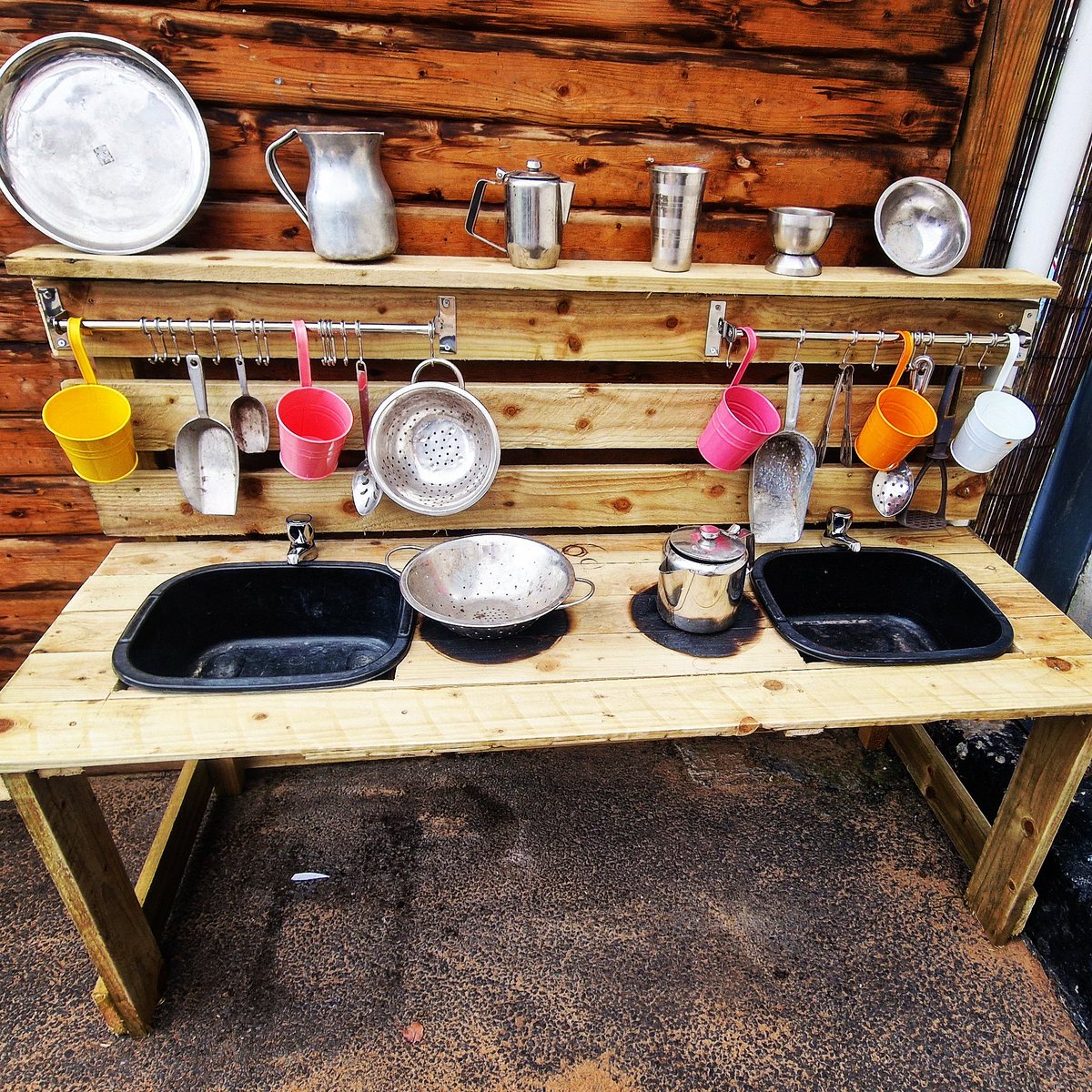 My dad made this mud kitchen for our EYFS children! Even at 32, I still need the support and help from my parents 🙈🥰. I have so many ideas for different learning opportunities using this! #eyfs #mudkitchen #outdoorlearning #learningopportunities #earlyyears #outdoorprovision
