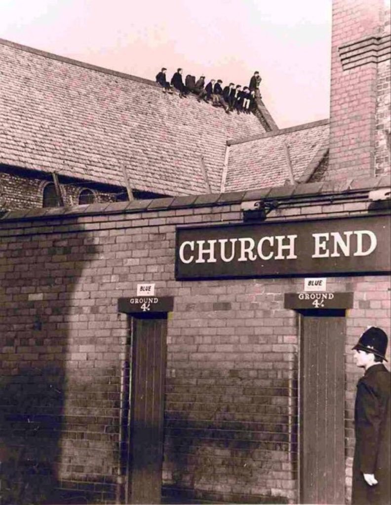 Young Everton fans climb on to the roof of St Luke's Church at Goodison Park to watch the action in the 1960s #EFC #Everton