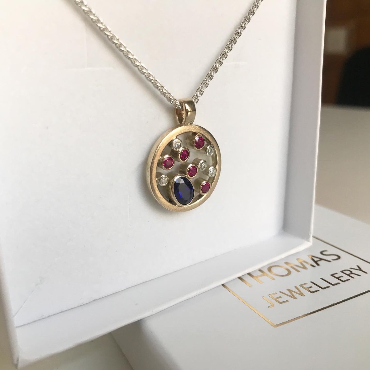 JewelleryLT's tweet photo. An item of jewellery that’s been hand crafted from the gold and stones of two sentimental rings. They’ve been combined into a bespoke modern two-toned gold pendant, with the diamonds set in the white gold to give them a little extra shine ✨ https://t.co/7B4U0JUg2E