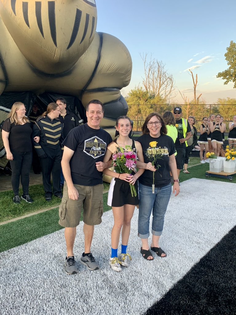 At Senior Night proud to walk through the Knights Tunnel and across the football twice with our two sport fall athlete cheerleading and golf.  She didn't have time to change into golf gear. #proudparents