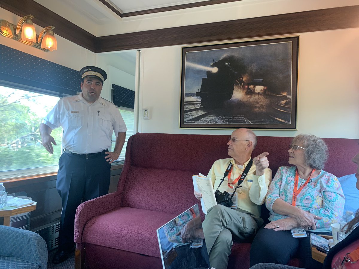 AAPRCO's tweet photo. @Metra Conductor Julio Negron chats with passengers aboard @AAPRCO’s Chicagoland Special. @Metra is this year’s host railroad for our special train for our 44th annual convention. Thank you Metra!

AAPRCO Photo. 09/03/2022. 

#trains #metra #railroads #chicago https://t.co/tQxY6K055o