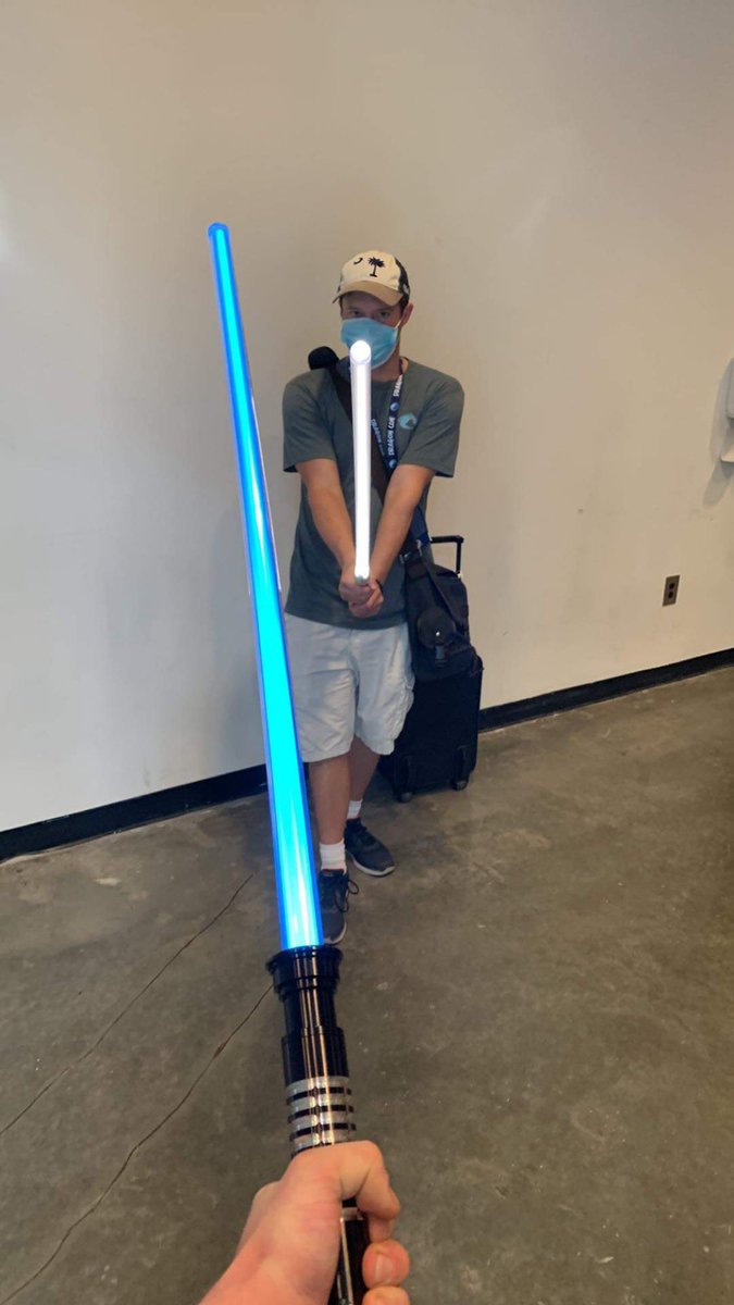 danimitetwitch's tweet photo. At Dragoncon for some Magic the Gathering and we found the Ultrasabers booth. I lucked out of the mystery saber box and got a sleek combat ready one with sound effects. https://t.co/fQnfS7S0ug