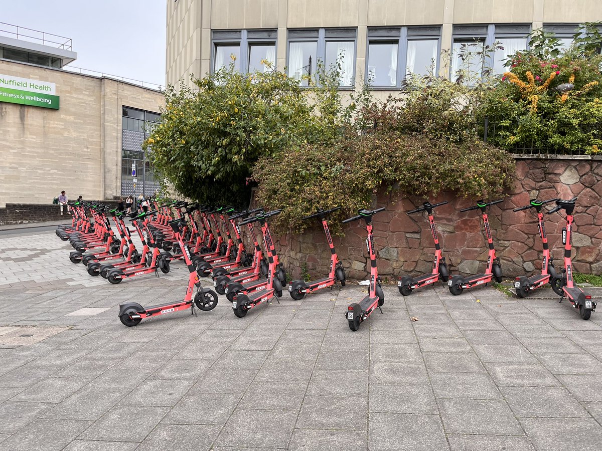 Bs8Living's tweet photo. @voitechnology this number of scooters, in an area that is believed to be private land, clearly marked ‘no e-scooters’. It’s ridiculous!! @BristolCouncil please investigate. https://t.co/eyb452sdLb