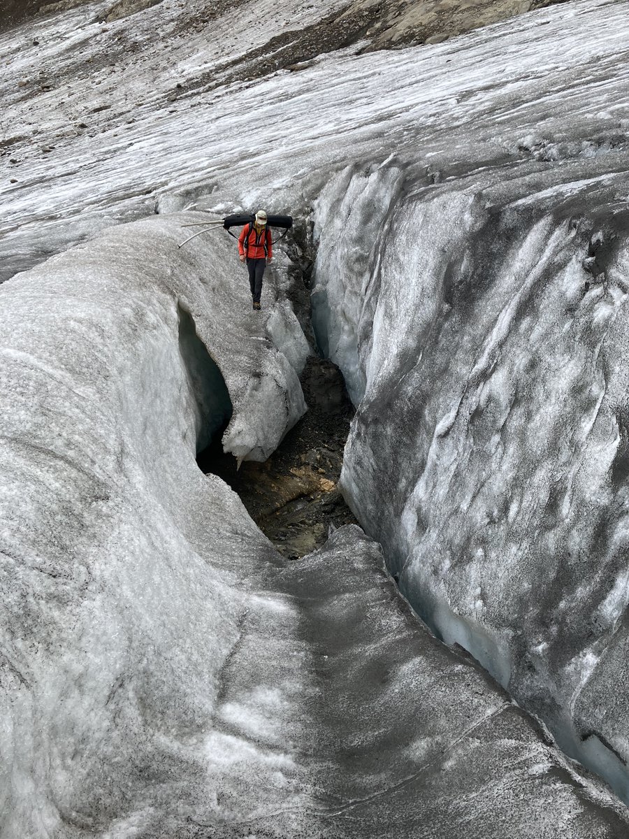 glamos_ch's tweet photo. A glaciologist left speechless on Griesgletscher: In the middle of the ice, the bedrock is visible in a crevasse. In only very few years from now, the ice will be gone here, thus splitting the glacier in two parts. 
The agony of a #glacier!
@VAW_glaciology @matthias_huss https://t.co/d0J6dRGCEy