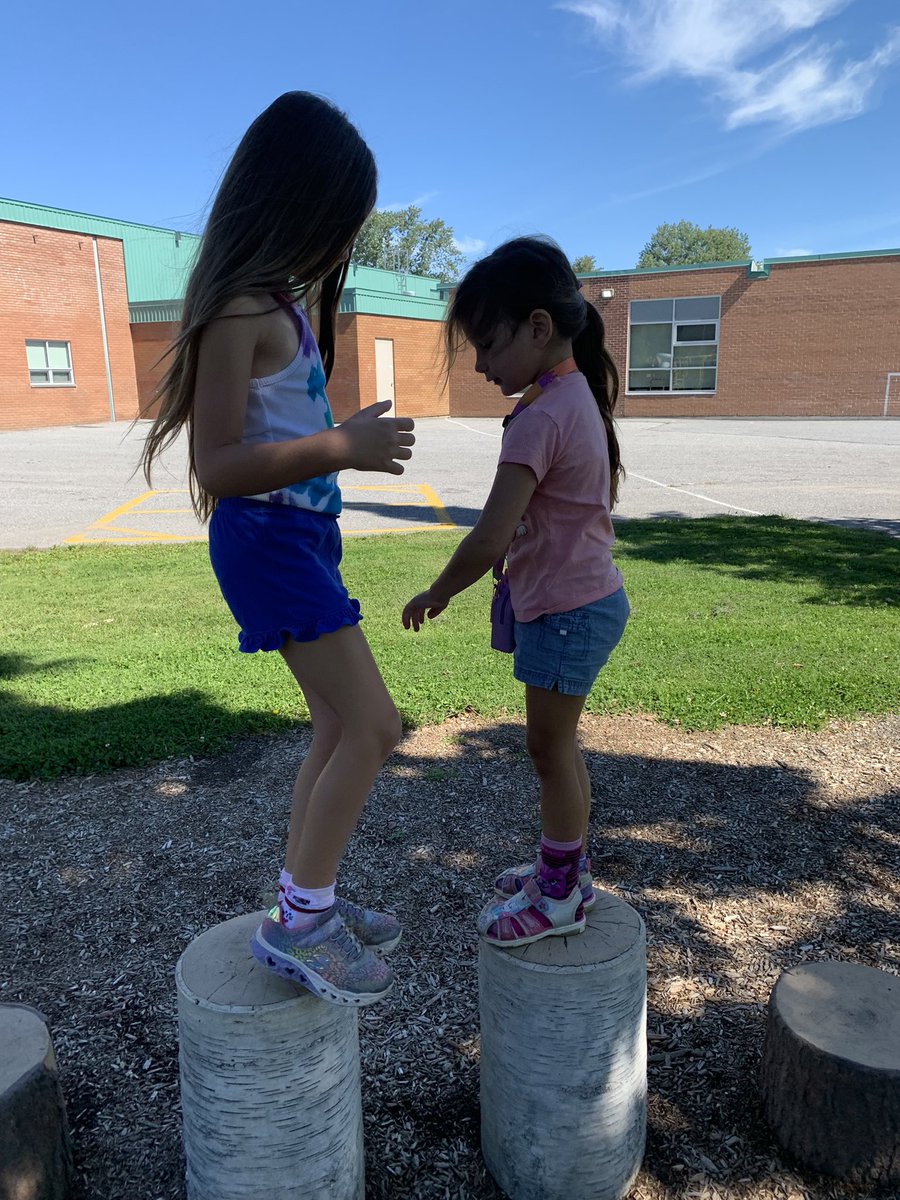 erika_wozniak's tweet photo. B and E were so excited to start school they wanted to go find their lines and check out the playground of course! They also rode their bikes all the way! #littlefalcons @StPhilipOCSB https://t.co/ch2UcOCTeG