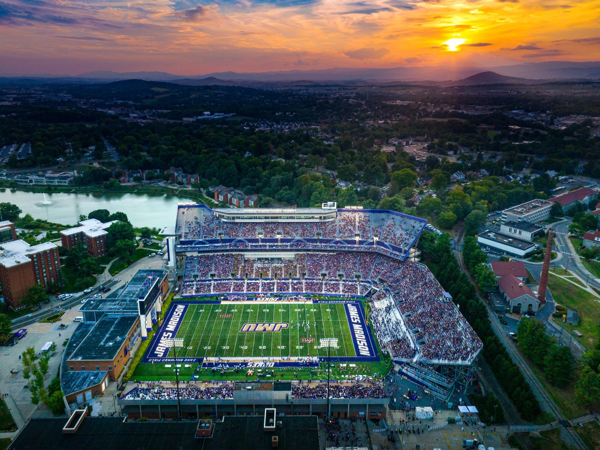 JMU's tweet photo. The sun sets on a historic day for all of JMU Nation. 

What a win, @JMUFootball! #GoDukes #WeBleedPurple https://t.co/mlYwN9U25i