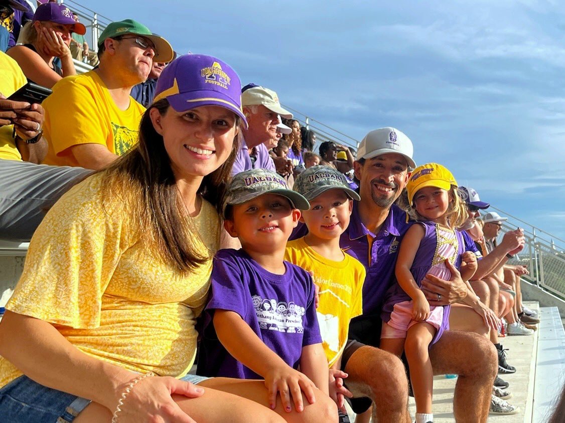ualbanyalumni's tweet photo. The Purple Fam always comes out to support Great Danes on the road! Alumni in Texas met up at McLane Stadium to cheer on @ualbanyfootball in yesterday’s game vs. Baylor. 

#UAUKNOW 

Photo: Juan Torres ‘06 and wife Rachael ‘07 with kids Lorenzo (7), Ezekiel (5), Liliana (3). https://t.co/nUOcv9Uig5