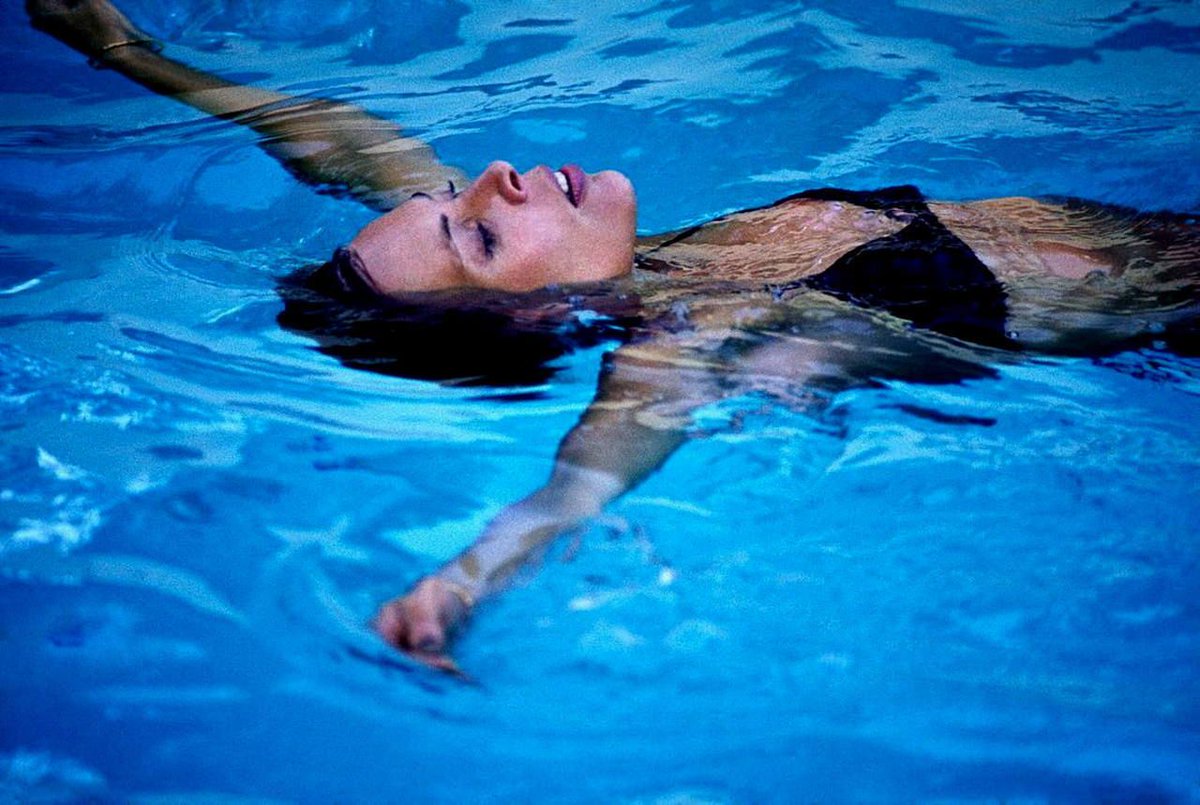 Soaking up the last few days of summer 

Photo from “The Hissing of Summer Lawns” series by Norman Seeff, 1975.