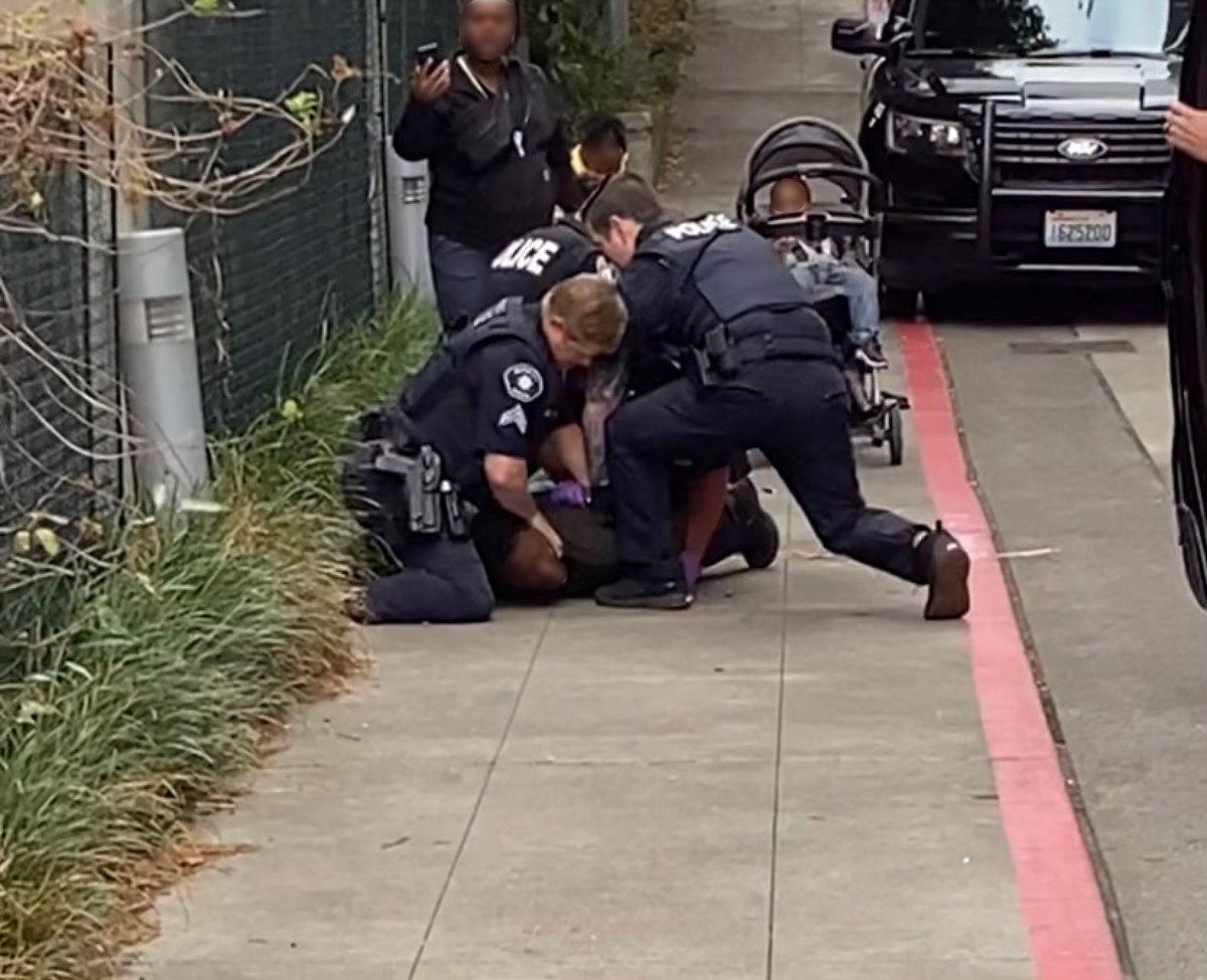 Heynongman14's tweet image. I witnessed Bellevue WA police harassing a black family walking downtown today. It appeared one cop wanted to search the baby stroller and the father wouldn’t let them. 5 officers tackled and pinned him and nearly tased him as his three young kids and partner looked on horrified.
