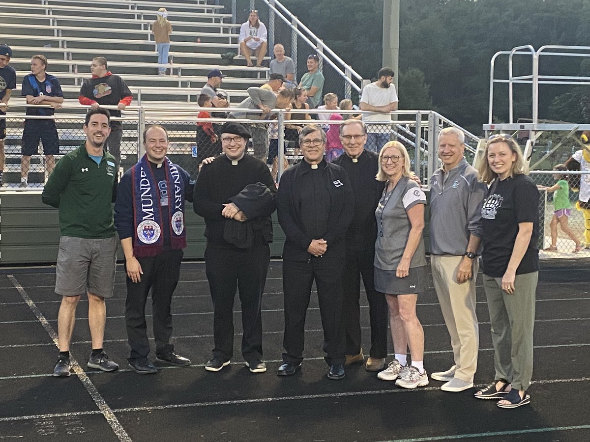 MFischerwc's tweet photo. #Blessed to have our chaplains, Msgr. Stalker, Fr. Mark, superintendent @dfaber7, prez @cynthiakneibel, future prez @JillAnnable and Mr. Nolan cheering on the falcons tonight. #GoWest #dogrcathed https://t.co/byEWGs2gvL