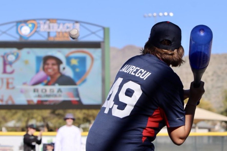 MIRROR IMAGE!

Miracle Leaguer Rosa Jauregui carefully concentrated on a baseball as it sailed through a gigantic scoreboard image of her carefully concentrating on a baseball.