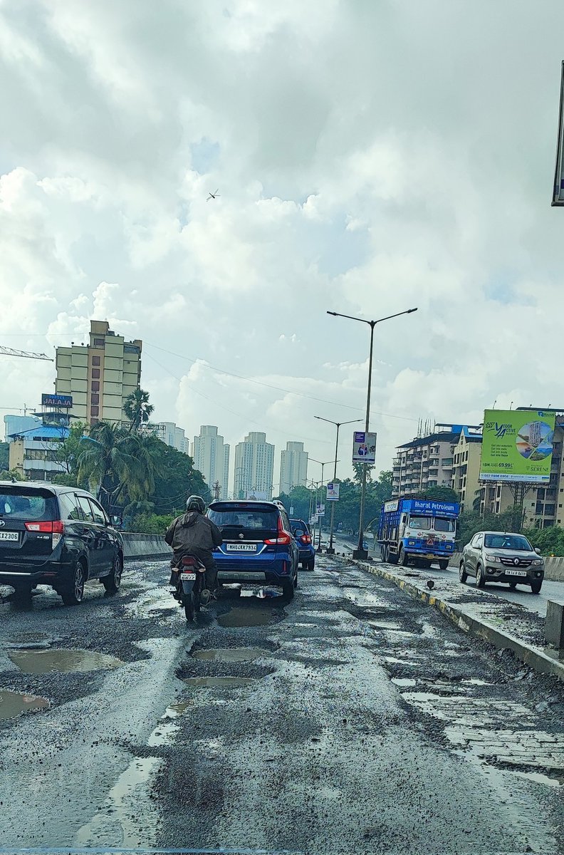 QueenofThane's tweet photo. Motorcross Adventure at Flyover nr Suraj Water Park Ghodbandar Road. It's not only this year but its every years affair. @MMRDAOfficial can yoi repair this ??? #mumbai #thane https://t.co/2L8DMU9Jdw
