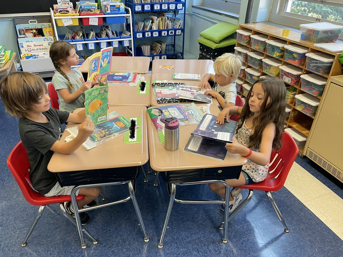 Check out these readers in action! We learned to make a pile and carefully turn each page. 📚