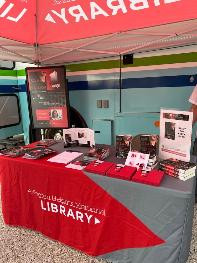 ahml's tweet photo. We’re having a great time at the #ArlingtonHeightsFarmersMarket today! We’re here from now through noon with the bookmobile - stop by to learn more about #OBOV2022 and to get your own copy of #ClarkAndDivision and an origami bookmark craft. More OBOV info: https://t.co/GaT62UUfpW https://t.co/Djik0VI8zo