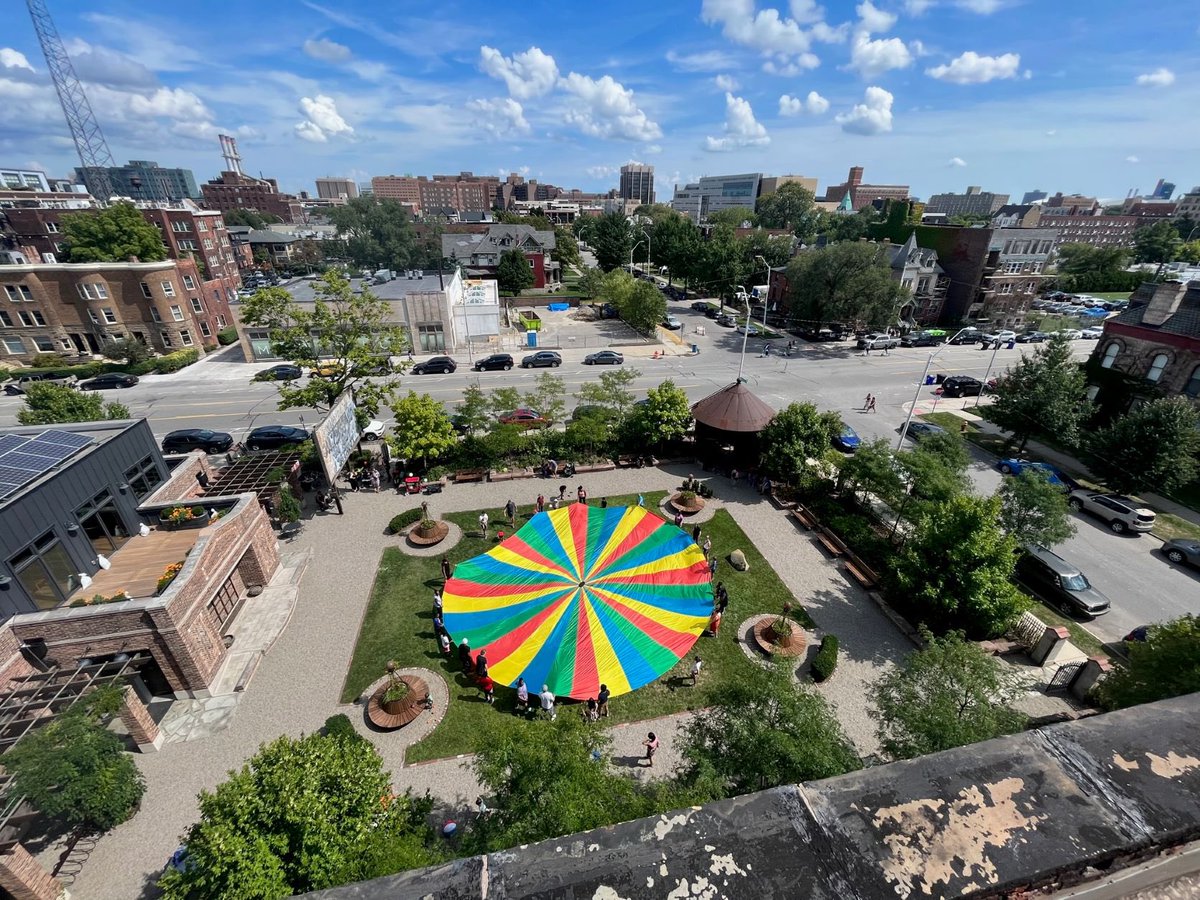 The <a href="/greengarage/">The Green Garage</a>, El Moore, and Seasons families want to offer a BIG thanks to everyone who made it out to our first annual Parachute Party in the Gardens last weekend. It was so much fun! Check out this great shot Michel snapped from the roof of the El Moore: