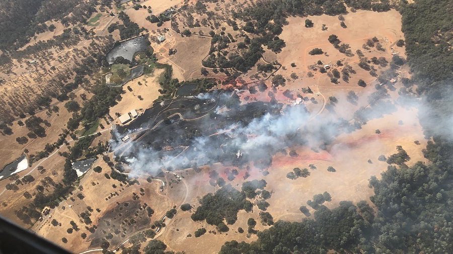 CALFIRENEU's tweet photo. 2:32pm update: firefighters have stopped the forward progress of the fire.￼

2:25pm update: approximately 30 acres with immediate structure threat. 

CAL FIRE firefighters responding to the report of a structure fire with extension to the vegetation off Garden Bar Road. https://t.co/iBJqi7tgkw
