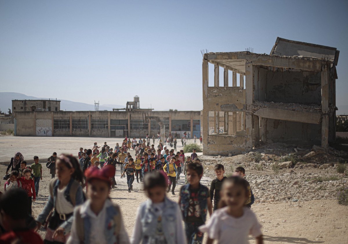 First day back at their half-destroyed school in #Idlib, northwest #Syria. Hundreds of schools have been damaged or destroyed by bombing, & far too many children remain out of school. We need to do more to repair schools & help get all children back into school