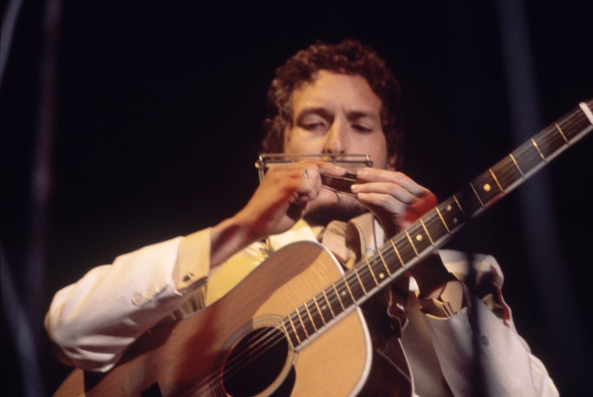 Bob Dylan playing at the Isle of Wight Music Festival, 1969.