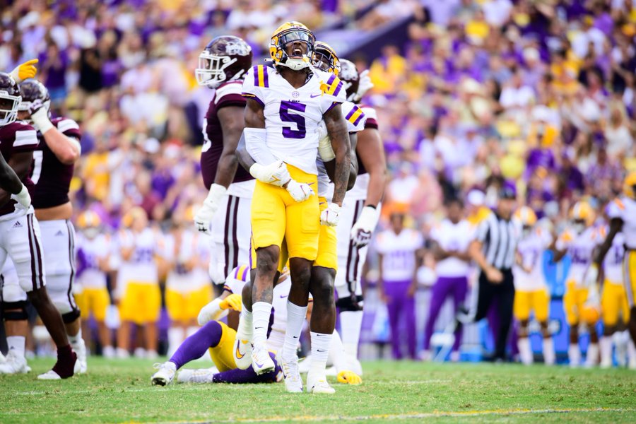 Jay Ward celebrates after making a tackle 