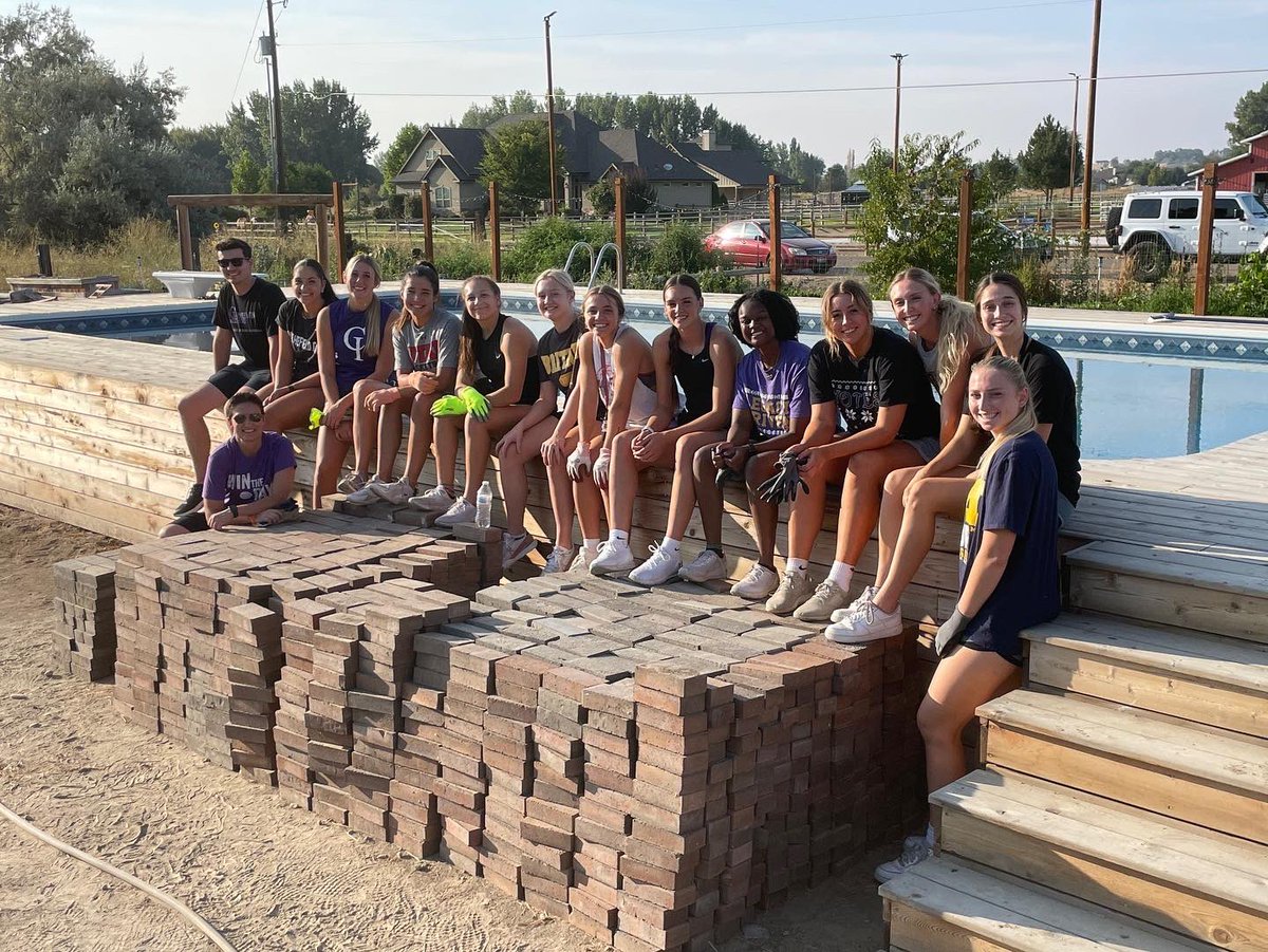 YotesWBB's tweet photo. Spent some time together off the court this week. Moving a few bricks to help aid in the building of a house for family from Ukraine and then going on a hike. Building Relationships off the court!  #ComeWinWithUs https://t.co/Ml2CW5Suzo