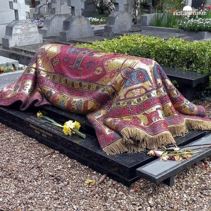 This is the tomb of Rudolph Nureyev, the great Russian dancer. The grave was designed to look like a carpet, but it's made entirely of bronze and glass.