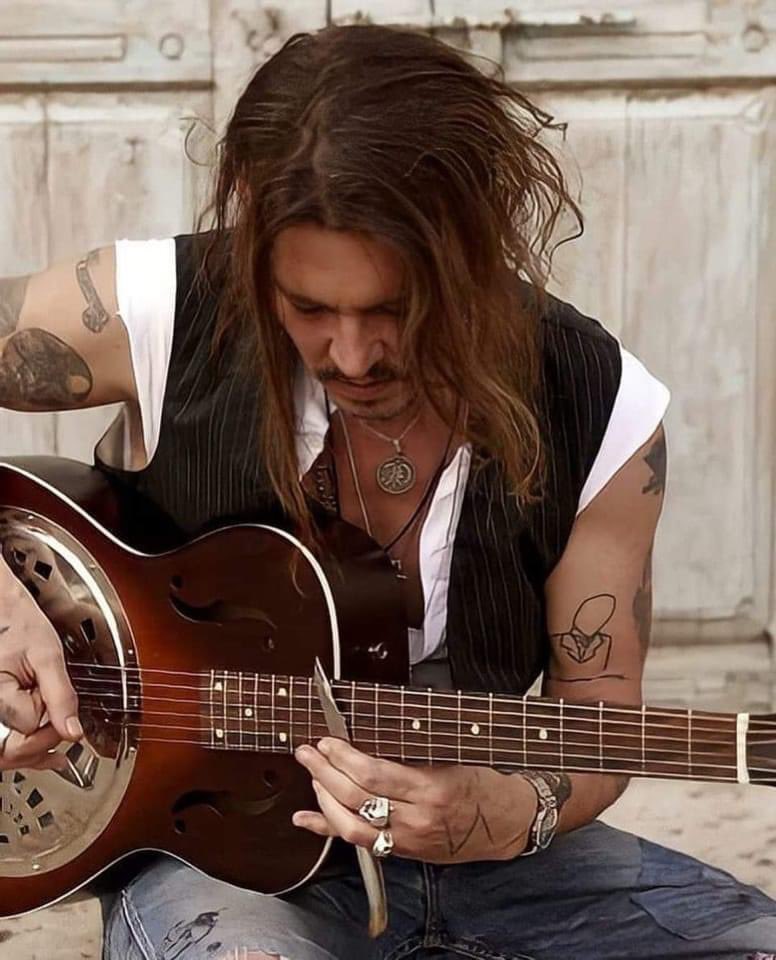 Enjoy the beauty that is Johnny and the love of his life; music. #JohnnyDeppWon #JohnnyDeppWillWinAgain #JohnnyDeppIsALegend #JohnnyDeppIsARockStar