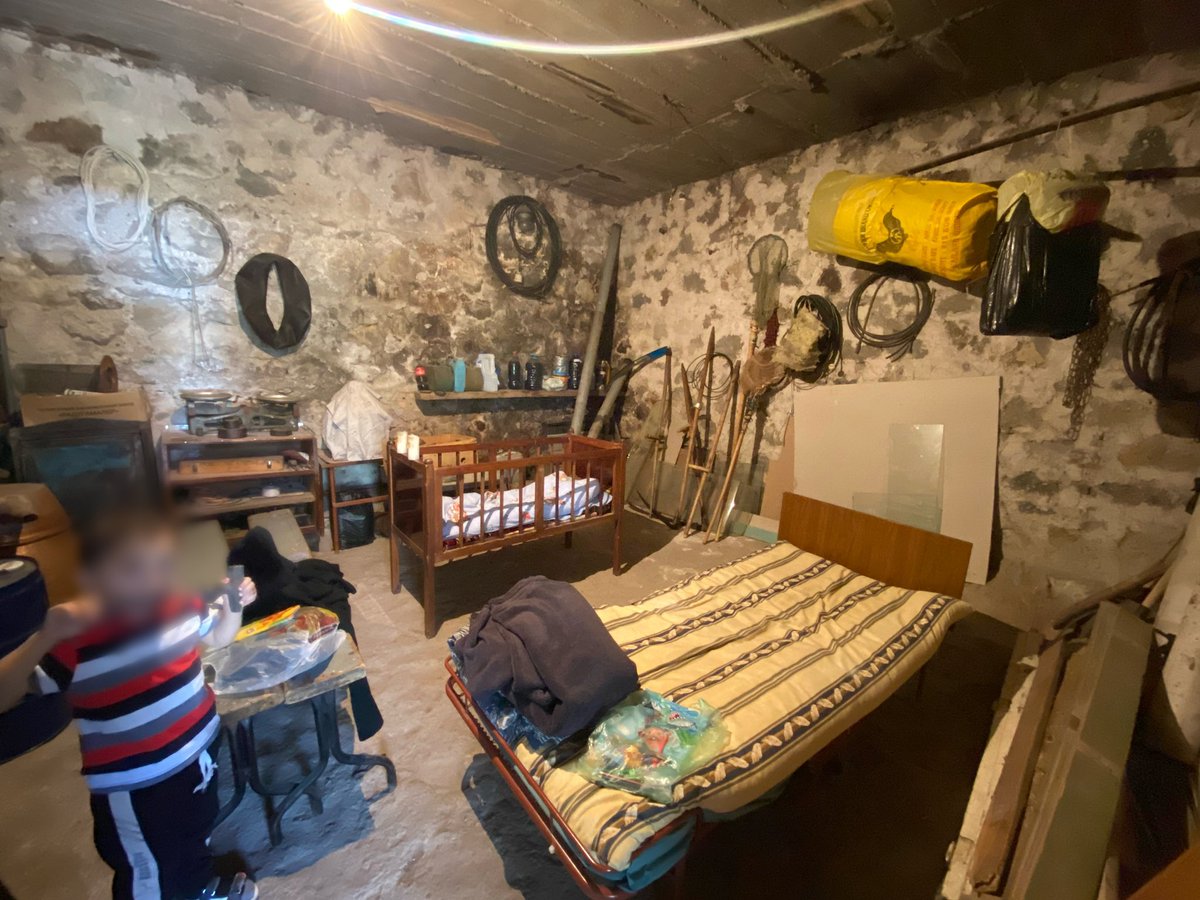 kooyrigs's tweet photo. Families are taking shelter in their bunkers, which are often ill equipped. For example, in this family the kids get the bed and the moms / aunts / grandmothers sit on stools (pictured next to the child) throughout the night. Not much rest is being had. https://t.co/YuLuQrSe3z