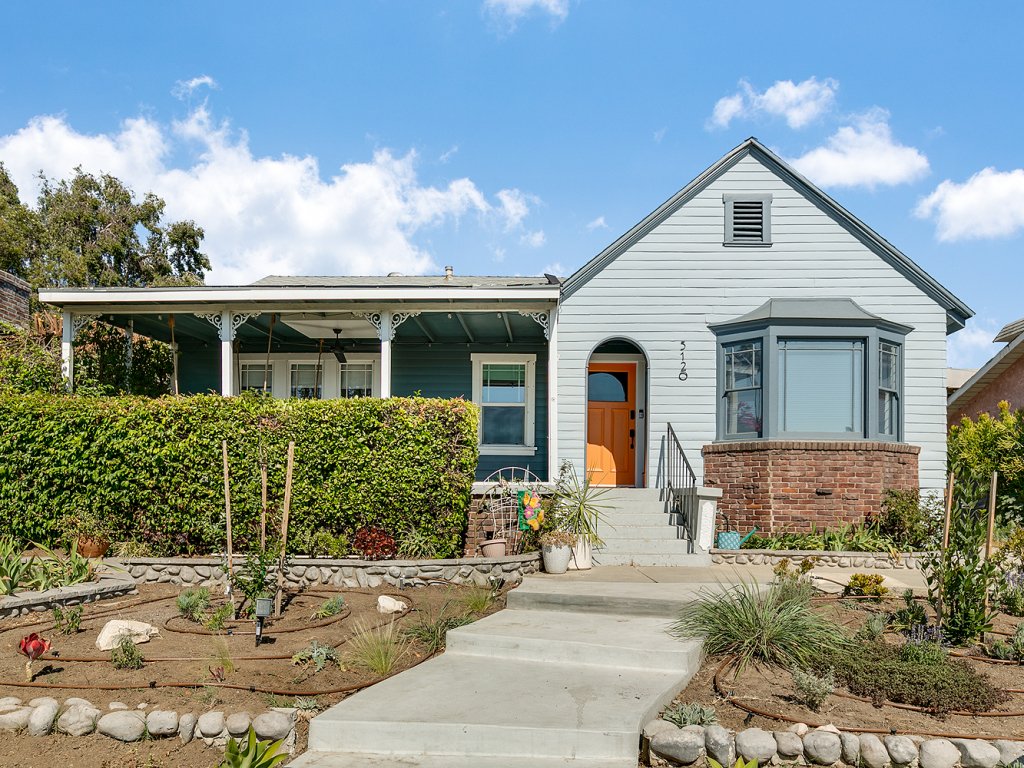 Leased! Remodeled Tudor home with three bedrooms, two baths, a converted garage, and a pool!