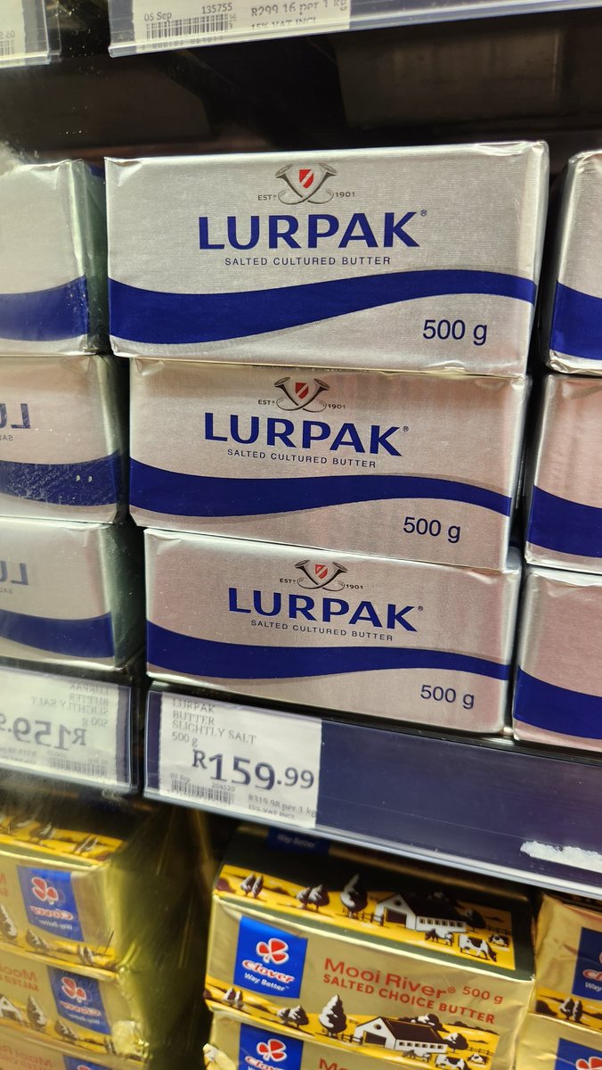 The Lurpak shelf strategy is to stack the product like gold bullion so the price per gram feels justified.