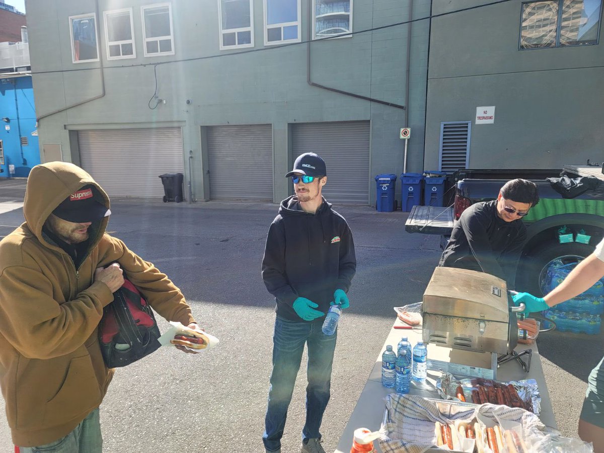 Feeding the homeless in Calgary yesterday. They brought a BBQ, some condiments, and some helpers. Parked downtown Calgary, set up and started bbqing. They fed over 100 people and didnt want any recognition. Well I had to share….