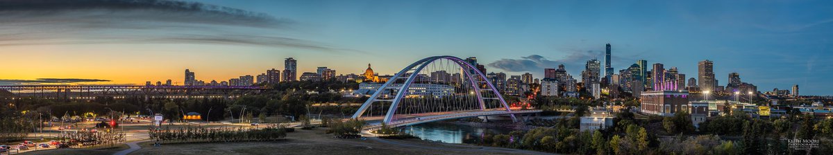A panoramic of a few buildings &amp; bridges in Edmonton lit in Royal Purple in Memoriam: Her late Majesty Queen Elizabeth II. 
It’s also 5 years since the opening of the new Walterdale bridge. #yeg #canon #photography #queen #exploreedmonton