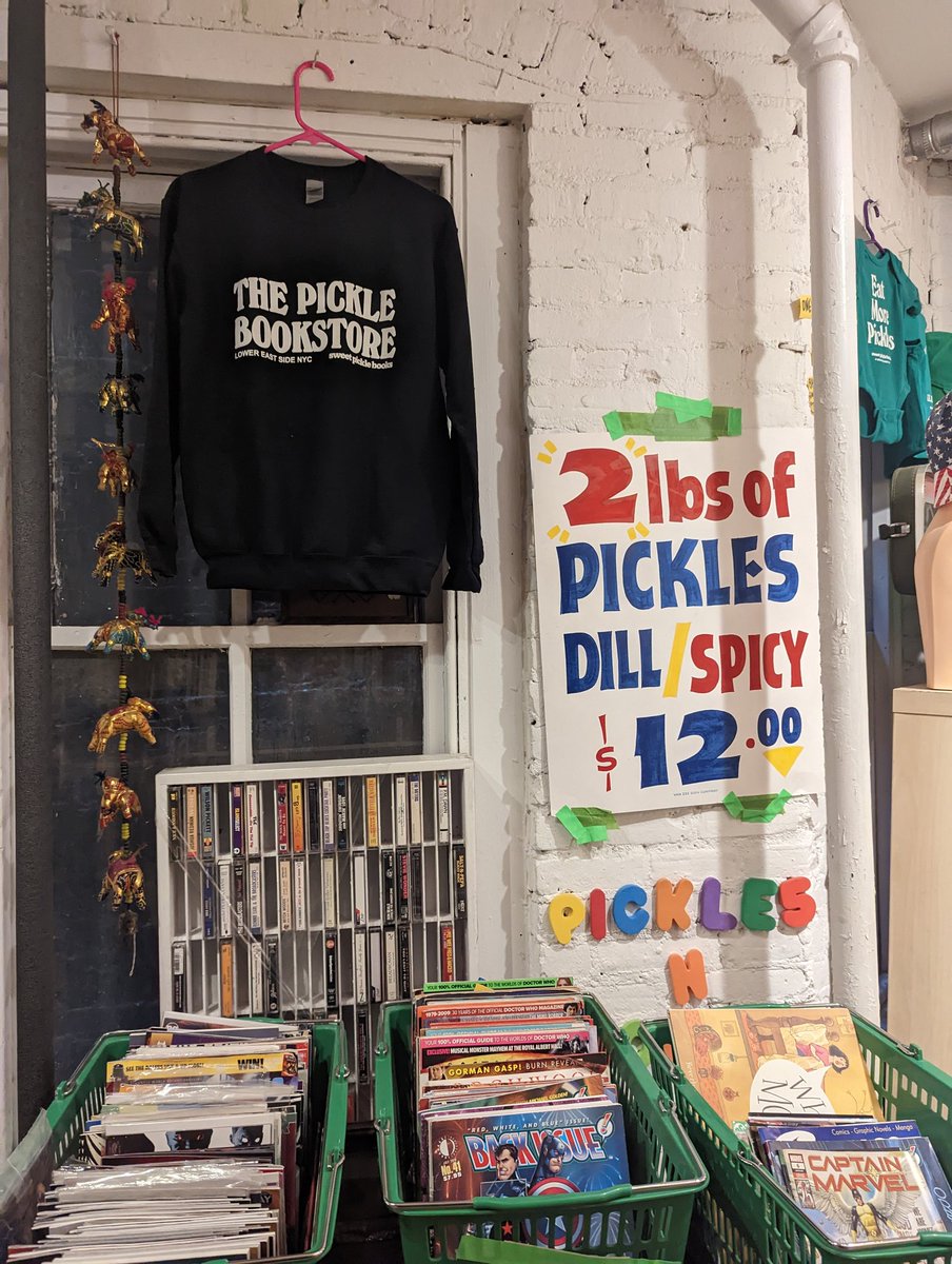 doctorow's tweet photo. Pickles n' books https://t.co/9yotfv67Si