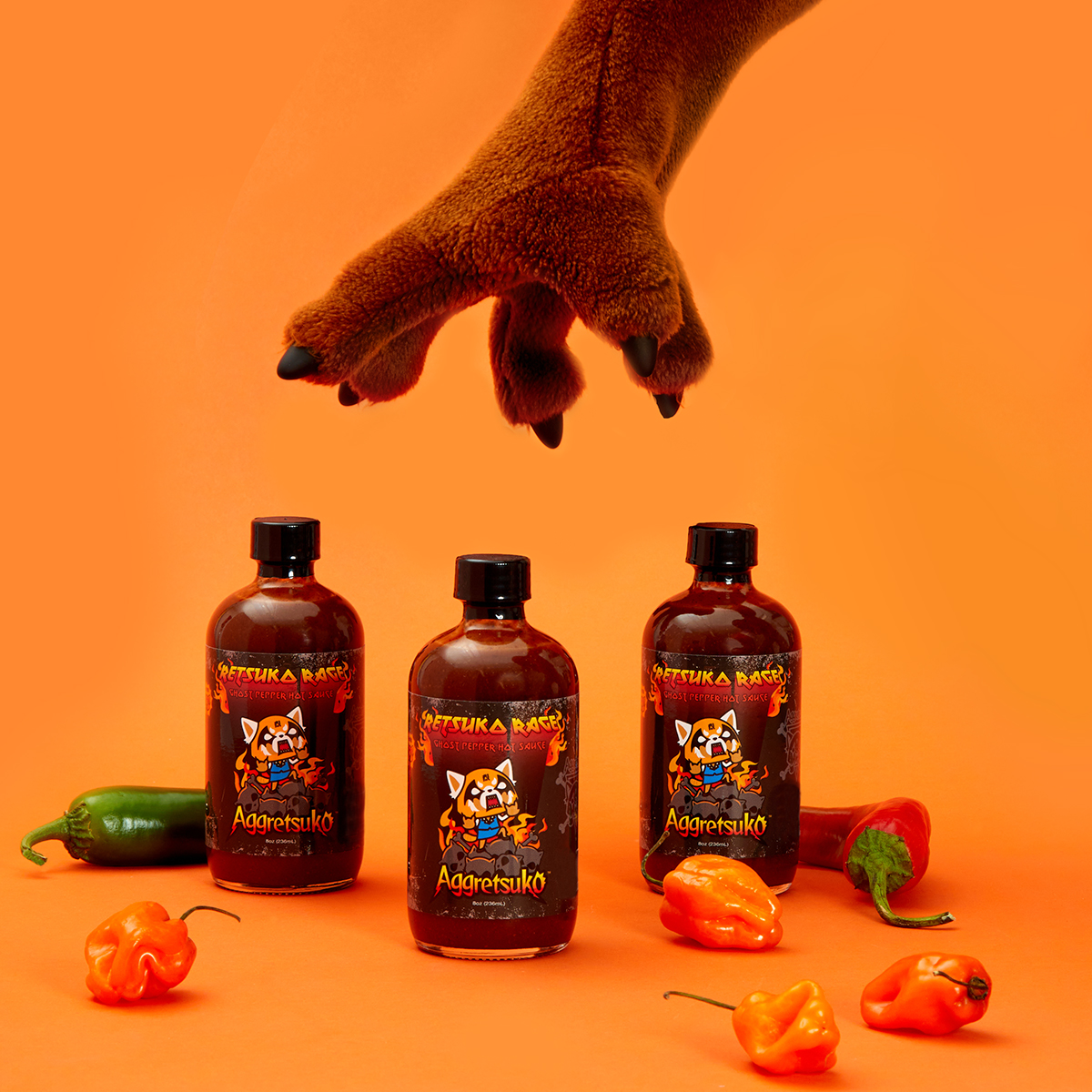 aggretsuko's tweet photo. Feel the RAGE with Aggretsuko’s Ghost Pepper hot sauce! 🌶️ 🔥 Available in stores and online at @officialfye: https://t.co/KghsDcMhgC https://t.co/uRG7Bi7yNJ