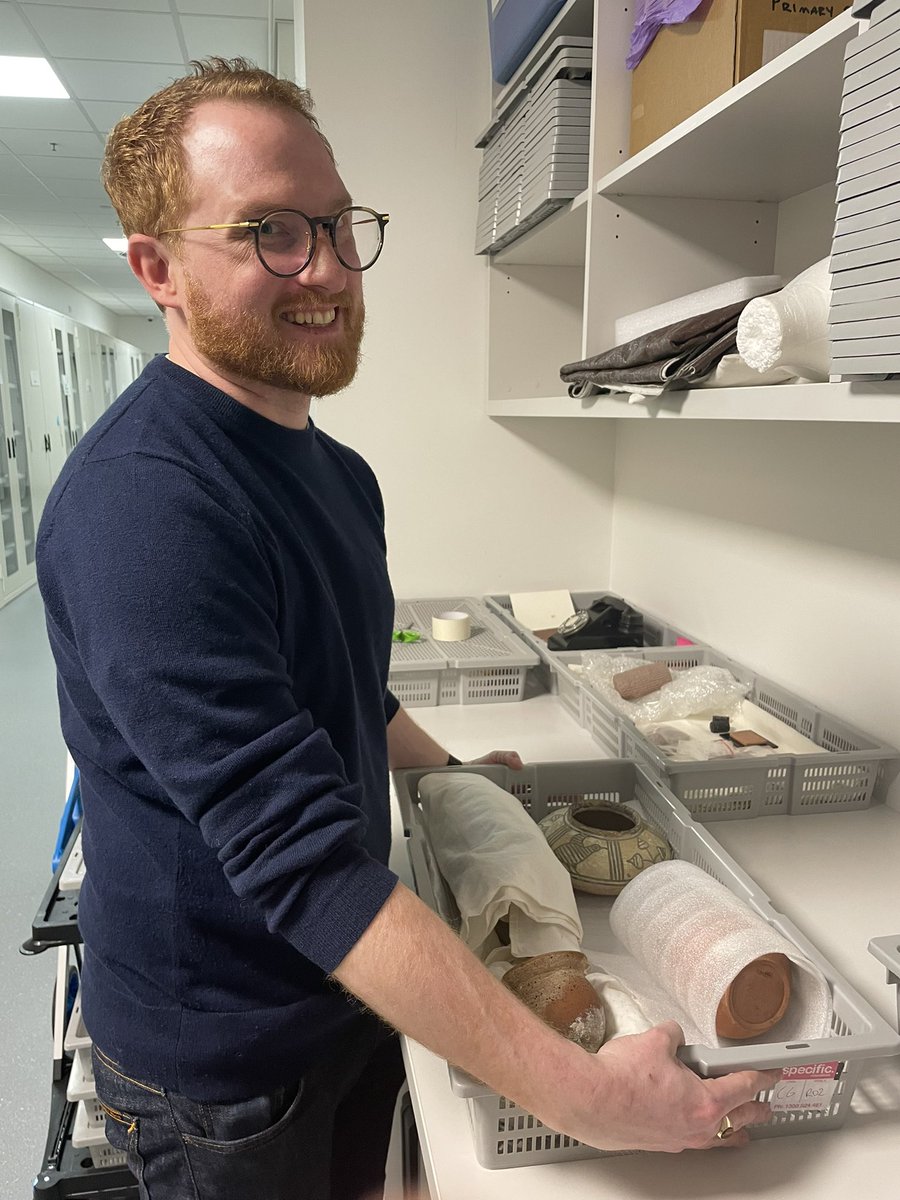 Macquarie_Uni's tweet image. Behind the scenes: my museum colleague Edward Cooper (also an archaeology student here at MQ), prepares objects for a handling session with students today. Most of our 18k objects are kept in this store room &amp;amp; much used in teaching and research #historyweek2022 @MacquarieMuseum