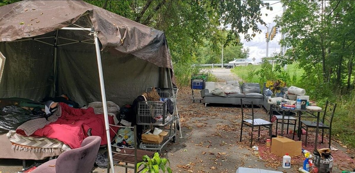 JerryJonesLA's tweet image. An outreach worker came across this encampment today and shared a picture with me. In a wooded area, a newly homeless person is trying to hold together some semblance of what they&apos;ve lost through eviction – a bedroom, a dining area, and what was once a living room. #heartbreaking