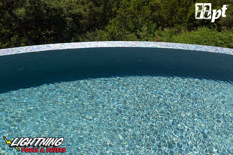 LightningPools's tweet image. Check out this beauty from National Pool Tile for your back yard design inspiration! StoneScapes Puerto Rico Blend Small Caribbean Blue pool finish and Lightwaves Sea Green pool tile energize this poolscape with colorful beauty. 🤩💦
#remodeling #remodel #swimming #swimmingpool