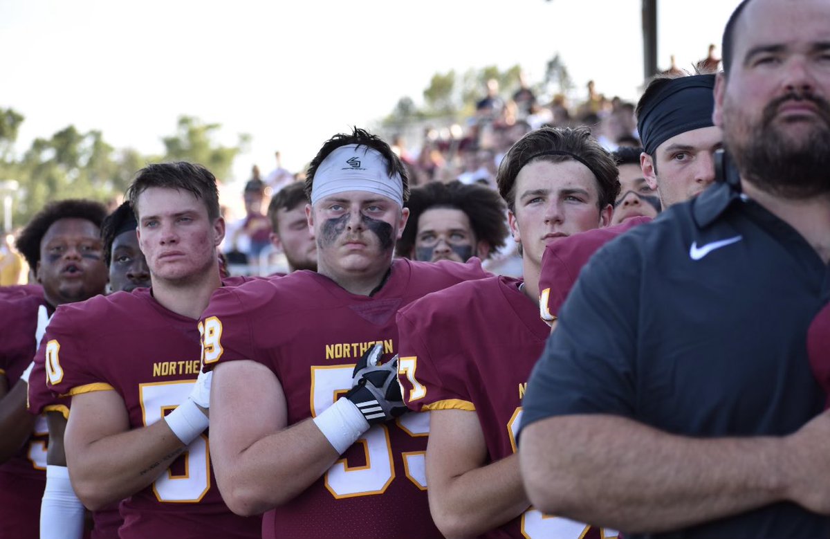 AlphaWolf2123's tweet photo. @GavinSmith_2023 front and center for the after practice message from Coach Dougherty! #78 #allin #GoWolves and @colt51dragon #59 showing his respect at the #nsuwolves home opener Thursday night. Couldn’t be prouder of my young men! https://t.co/CUDdpHnXn2