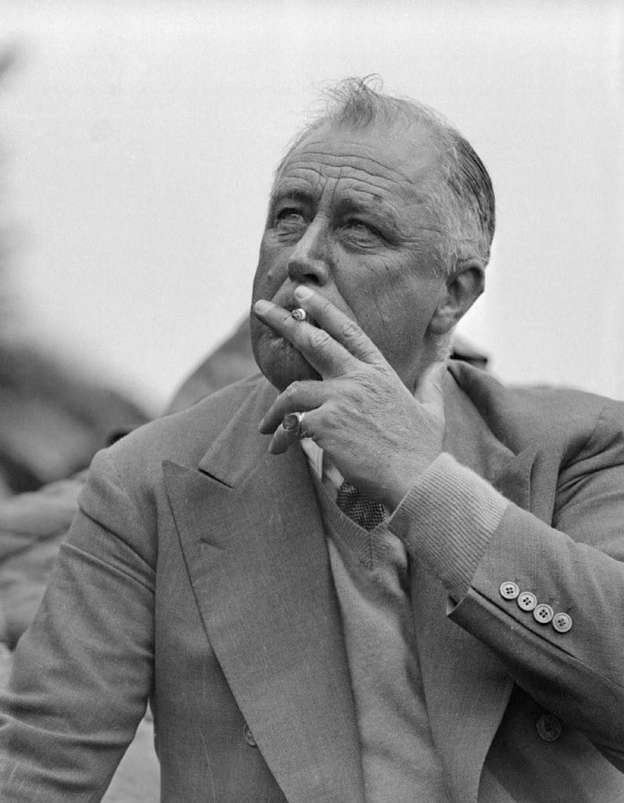 Franklin D. Roosevelt smoking a cigarette. July 1936