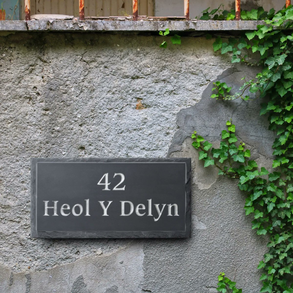 This beautiful Welsh slate house plaque has been finished with a rustic pitched border, beautifully highlighting the layers in the slate 😍 
 #stonesign #stoneplaques #houseplaques #housesign #houserenovation #sign #stone #calligraphy #handfinished #stonemasonry #signage #font