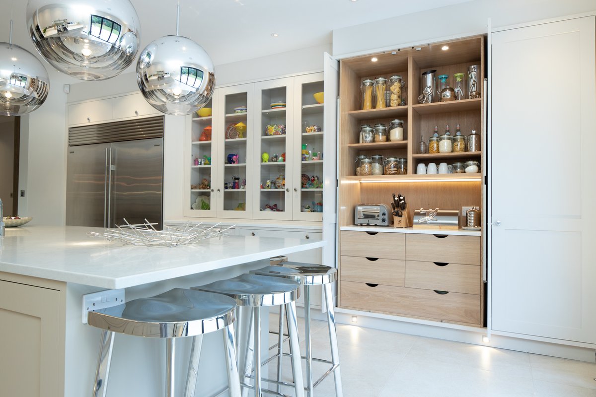 On display or hidden away? Both! When it’s appropriate. The mix of glazed windows on the display cupboards, and pivoting doors that hide away for this larder, embrace both approaches to storage in this fabulous kitchen.