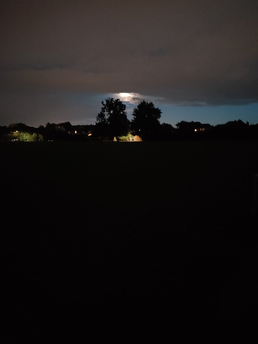 AndrewCadman1's tweet photo. @JustGreatPhotos perfect alignment of the moon and streetlight. Taken on phone so not nearly as good as your usual retweets 🙂 https://t.co/4tVlOSbknz