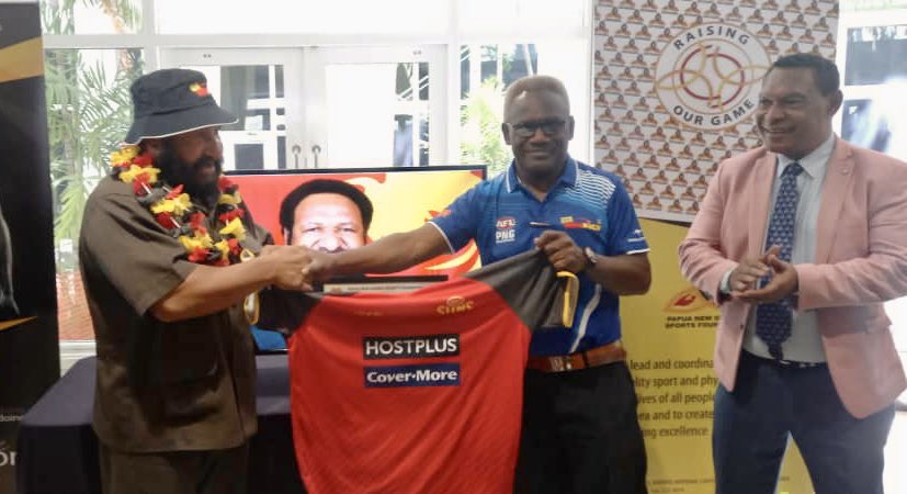 Thank you Papua New Guinea Sports Foundation CEO Mr Veratau for the opportunity to hear from and meet Hon Don Poyle, MP - PNG Minister for DHERST &amp; Sport  

AFLPNG Development Chairman Mr Ekonia Peni was honored to present Hon Don Poyle his own Gold Coast Suns Training shirt